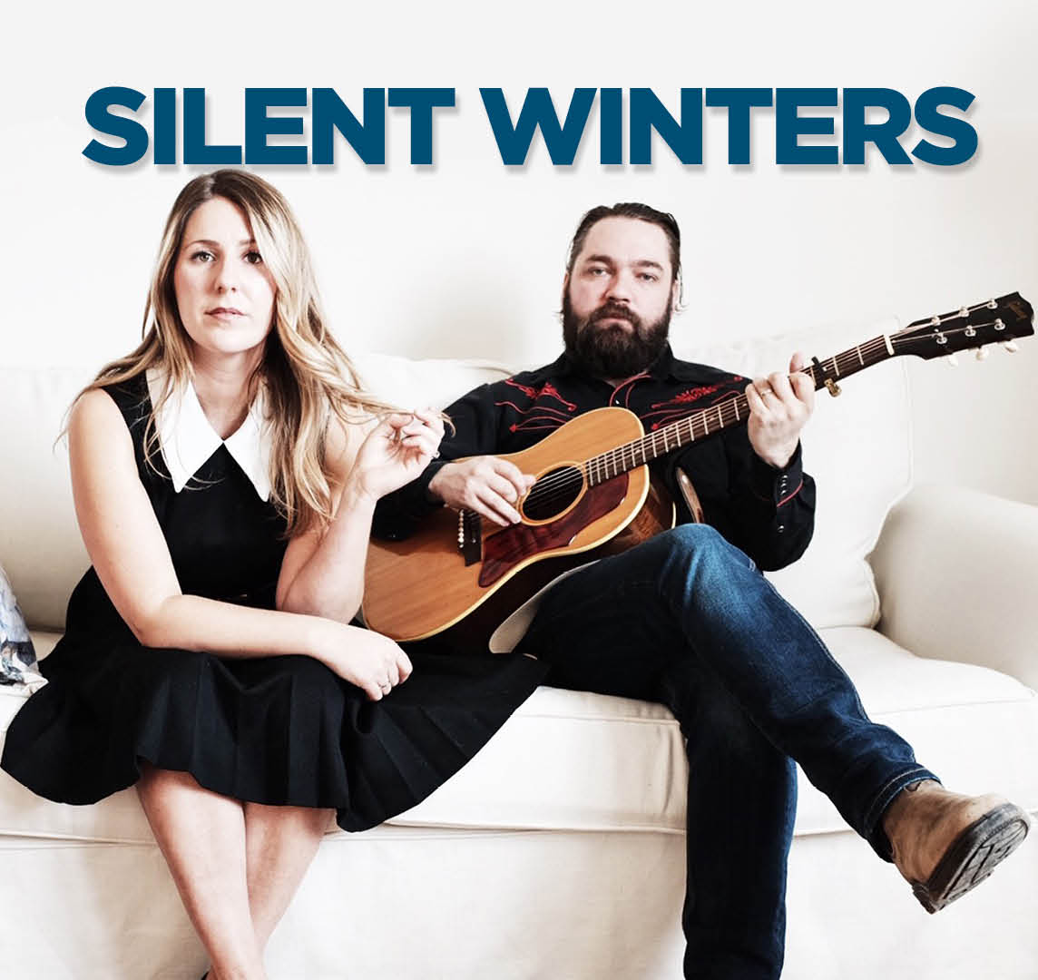 Silent Winters - image of two musicians sitting on a sofa with white background